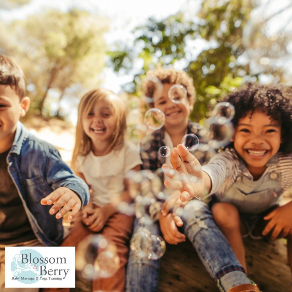 Top 5 Business Ideas for Mums Working from Home with Young Children - picture of 4 children 2 boys and 2 girls sat blowing bubbles
