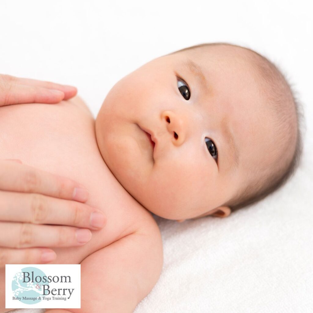 Baby Massage for Babies with Heart Conditions: Safety Tips and Gentle Techniques - picture of a baby on it's back with a parents hands on it's chest
