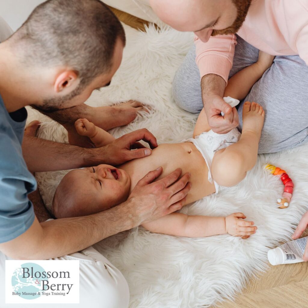 Can I Massage My Baby’s Head? - two dads massaging a crying baby