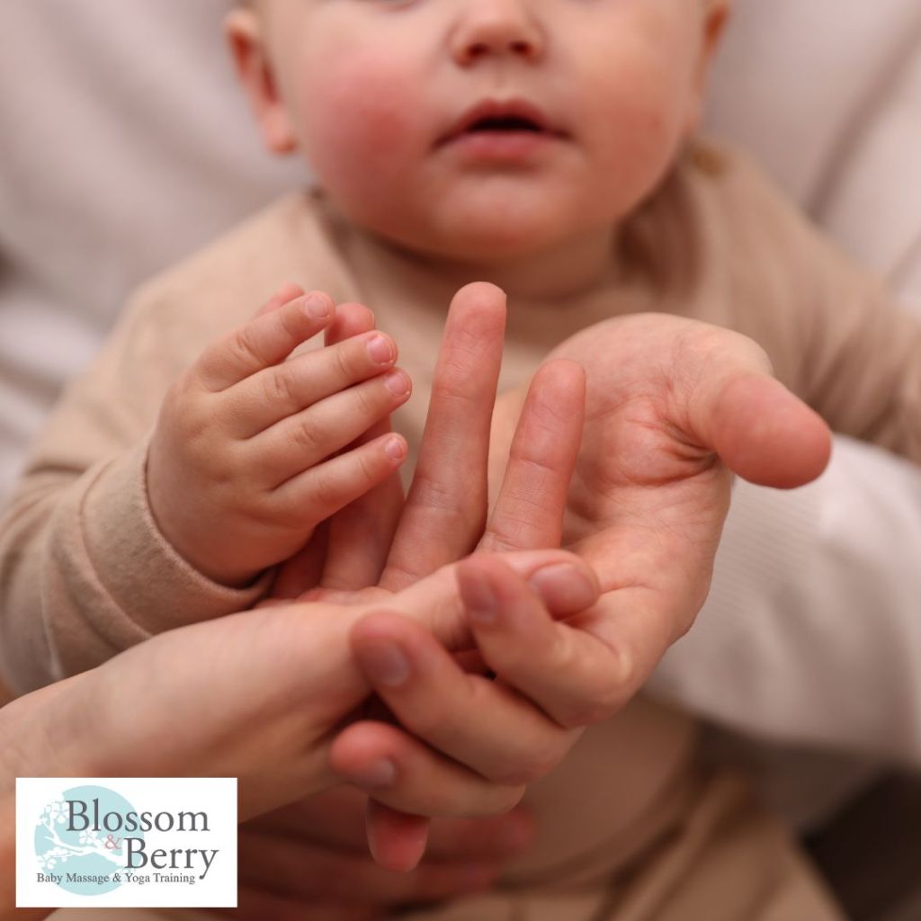 Love-Based Learning: Why Right Brain Development Matters Most in Infancy - picture of a baby playing with a parents hands