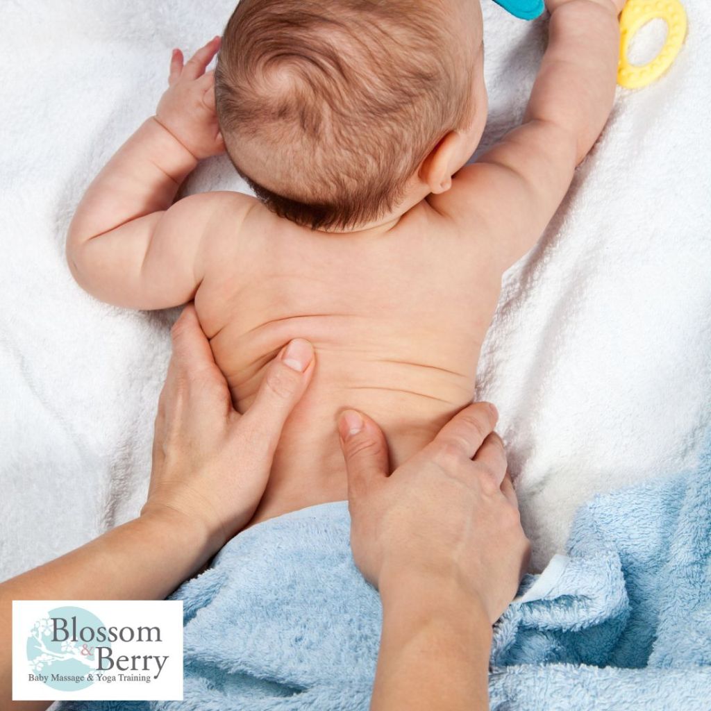 What Do You Need to Massage Your Baby? Essential Supplies for Bonding - picture of a baby face down with a parents hands on her back