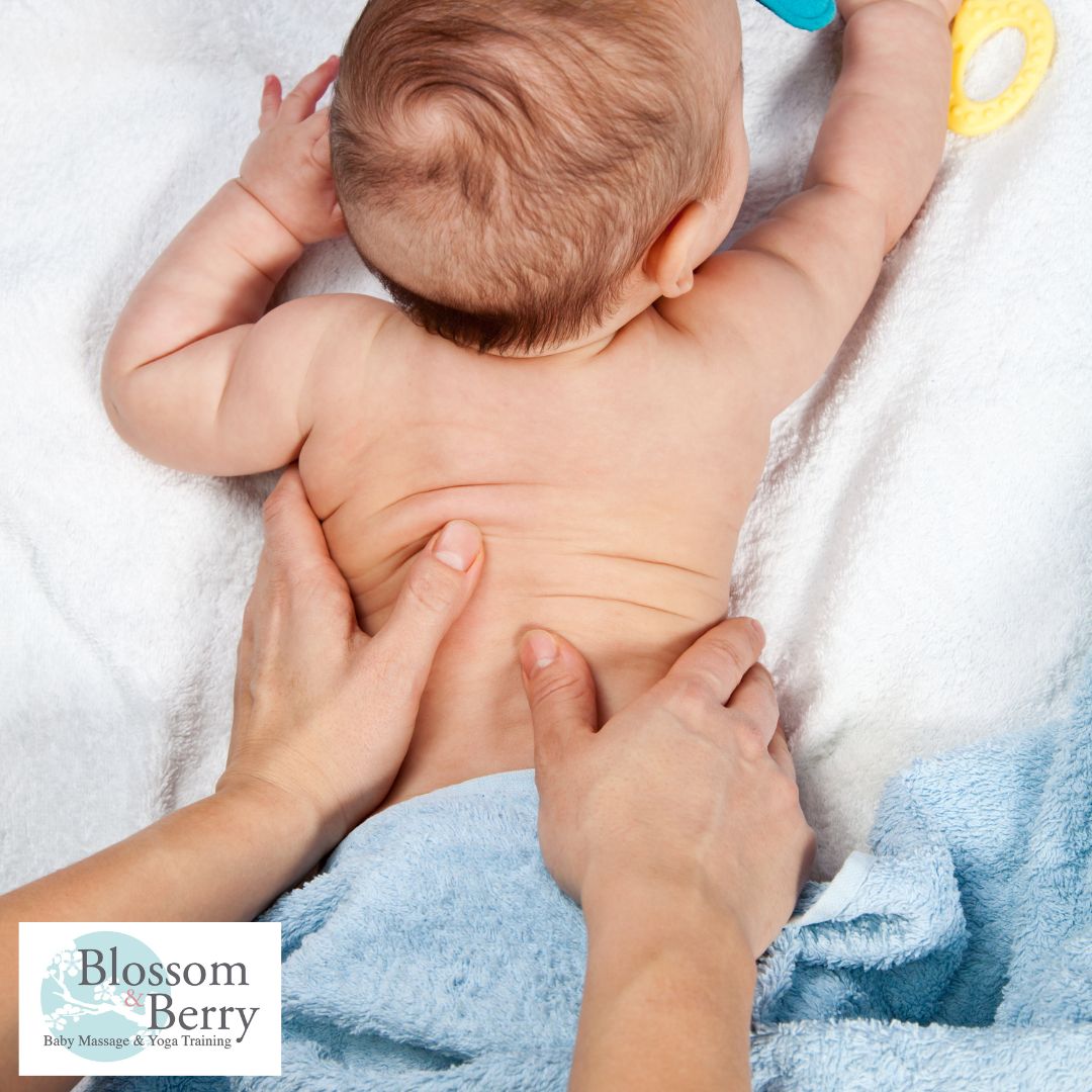 What Do You Need to Massage Your Baby? Essential Supplies for Bonding - picture of a baby face down with a parents hands on her back
